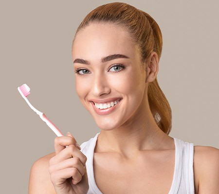 Woman brushing her teeth