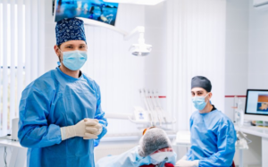 Two dentists getting ready to help a patient with their dental emergency